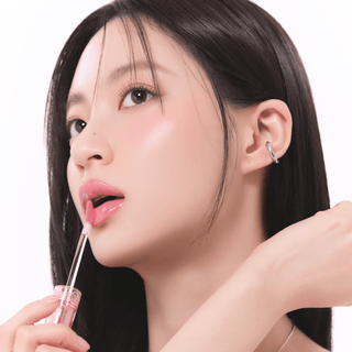 Rom&nd Glasting Colour Gloss lip gloss with shiny, smooth finish in vibrant packaging.