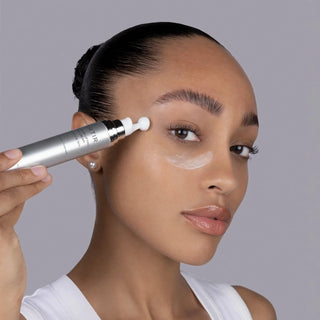 TIRTIR Collagen Lifting Eye Cream in 15mL jar, featuring smooth cream texture and eye-shaped packaging.