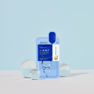 Mediheal The N.M.F Ampoule Mask sheet laid flat, showing the packaging with product name and brand on a white background.