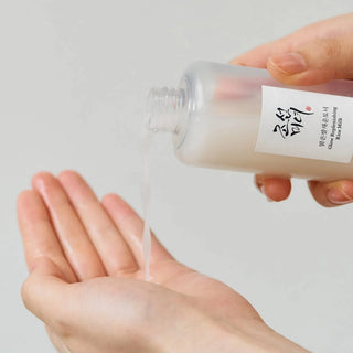 Beauty of Joseon Glow Replenishing Rice Milk toner in a 150mL bottle, with soft white and light pastel design elements.