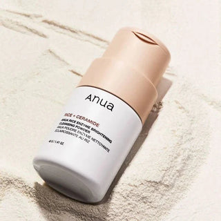 Anua Rice Enzyme Brightening Cleansing Powder in a 40g jar, showcasing the powder's texture and packaging.