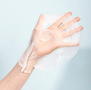 APLB Tranexamic Acid and Niacinamide face sheet mask showing the mask soaked in serum, designed for brightening and skin tone improvement