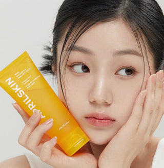 April Skin Calendula Peel Off Mask 100g, face sheet mask with natural calendula ingredients, displayed in a sleek jar.