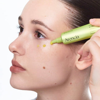 Arencia Vitamin C Booster Shot 30ml in a clear glass bottle with a white label and orange accents, focused on the product.