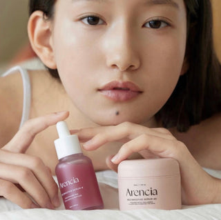 Arencia Pore Perfection Collagen Serum Duo bottles with clear labels, featuring a sleek design for improved skin and pore care.