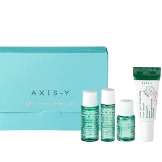 Axis-Y Mini Glow Skin Care Set with four small bottles including 8ml and 5ml sizes, designed for brightening and skincare.