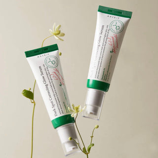 Axis-Y Dark Spot Correcting Glow Serum, anti-pigmentation spot serum with a dropper bottle and clear label, designed to reduce dark spots.
