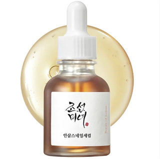 Beauty of Joseon Revive Serum featuring ginseng and snail mucin for brightening and skin renewal in a clear serum bottle.