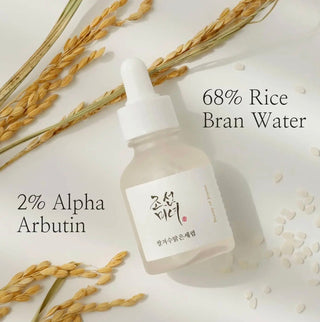 Beauty of Joseon Glow Deep Serum with rice and alpha-arbutin, featuring a sleek bottle and serum dropper for skincare.