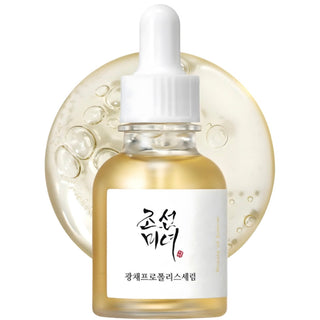 Beauty of Joseon Glow Serum with Propolis and Niacinamide, clear glass bottle with dropper, showcasing the serum inside.