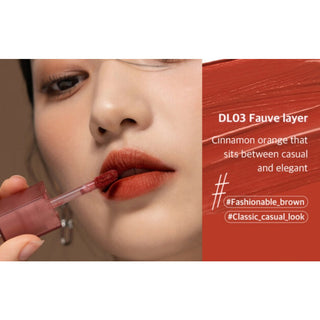 Black Rouge Double Layer Over Velvet lipstick with salmon-colored and black velvet layers, showcasing its stylish design.