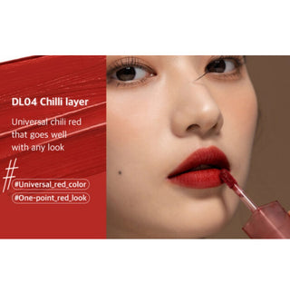 Black Rouge Double Layer Over Velvet lipstick in salmon color, showcasing its sleek black and vibrant layered design.
