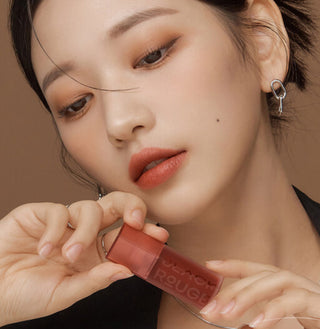 Black Rouge Double Layer Over Velvet lipstick with salmon and black layers, showcasing a sleek, dual-color lipstick design.