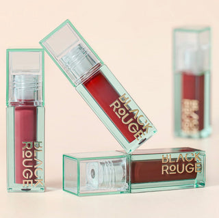 Black Rouge Double Layer Over Velvet 3 lipstick in amber carat shade, showcasing its sleek black tube and luxurious finish.