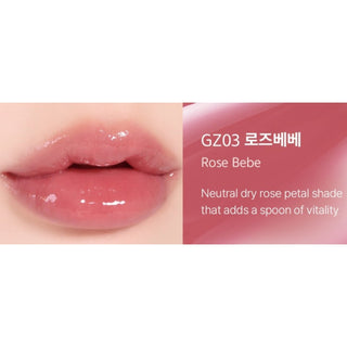 Black Rouge Chewy Lip Glaze lipstick in a sleek black tube with a clear cap, featuring a glossy, vibrant lip color.