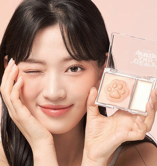 Black Rouge Dewy Whip Cheek and Beam makeup product in strawberry shade, featuring creamy, dewy blush and highlighter in sleek packaging.