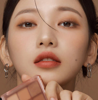 Black Rouge Colordation Mood Palette makeup with warm brick-toned eyeshadows and versatile shades for creative eye looks.