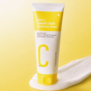 Deoproce Vita C Toning Care Capsule Foam in a bottle, showing the foaming cleanser with vibrant orange accents.