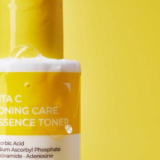 Deoproce Vita C Toning Care Essence toner bottle with bright orange cap and clear liquid, skincare product for brightening and toning.