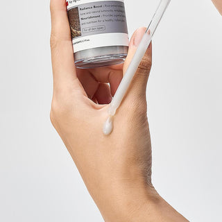 Dr.Melaxin Peel Shot Exfoliating Black Rice Ampoule 80ml bottle showing black rice extract and sleek packaging.