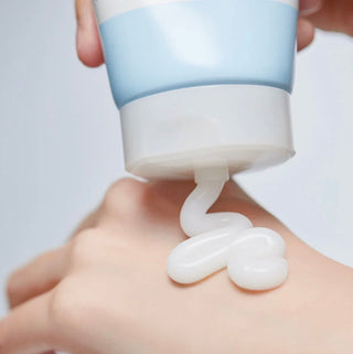 Illiyoon Ceramide Ato Soothing Gel in a clear jar, showing its creamy texture and soothing properties for sensitive skin.