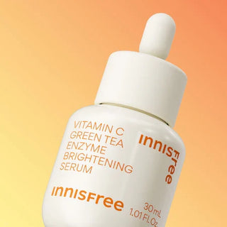 Innisfree Vita C Green Tea Enzyme Brightening Serum 30mL bottle, featuring a sleek green and white design, for radiant skin.