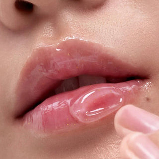 Mini sample of Laneige Bouncy & Firm Lip Treatment showing the small jar with pink lip balm inside, designed for nourishing lips.
