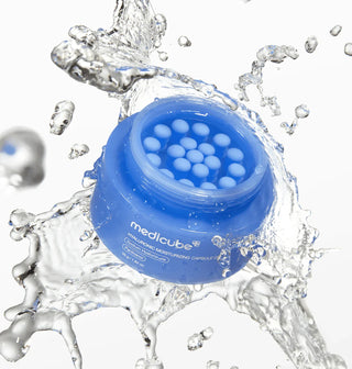 Medicube Hyaluronic Moisturizing Capsule Cream 50g jar showing the cream's smooth texture and packaging design.