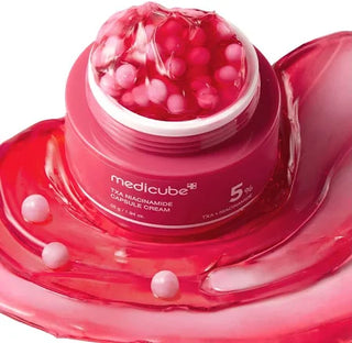 Medicube TXA Niacinamide Capsule Cream 55g jar showing the cream's smooth texture and packaging with capsule design on the label.