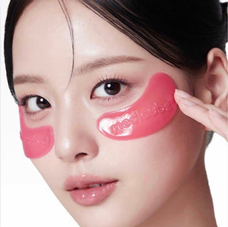Medicube PDRN Pink Collagen Jelly Eye Mask in a pouch, showing a soothing pink gel-filled eye mask for revitalizing skin.
