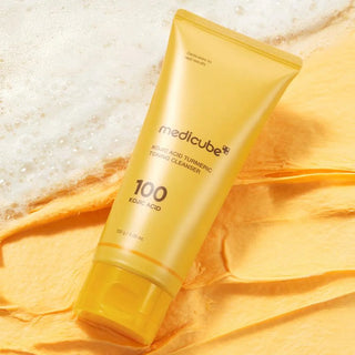 Medicube Kojic Acid Tumeric Toning Facial Cleanser 120g bottle with label and cap, designed for brightening and cleansing skin.