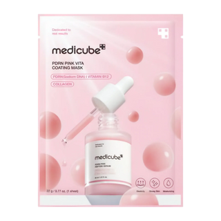Medicube PDRN Pink Vita Coating Face Sheet Mask lying on a white surface, showing the vibrant pink packaging and mask details.