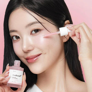 Medicube PDRN Pink Peptide Serum bottle, 30mL, with pink and white packaging, showcasing the skincare serum for revitalizing skin.
