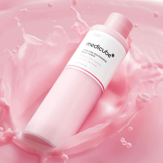 Medicube PDRN Pink Niacinamide Milky Toner in a 150mL bottle, showing the light pink, milky liquid inside the bottle.