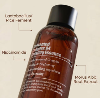 Bottle of Purito Seoul Fermented Complex 94 Boosting Essence with a clear label, showcasing the skincare product in a simple, clean setting.