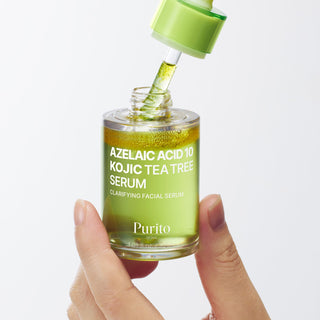 Purito Seoul Azelaic Acid 10, Kojic Acid, and Tea Tree Serum in a 30ml bottle, showcasing the serum with its packaging and dropper.