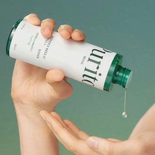 Purito Seoul Wonder Releaf Centella Toner in a 200ml bottle, featuring a clear liquid with a minimalist label and pump dispenser.