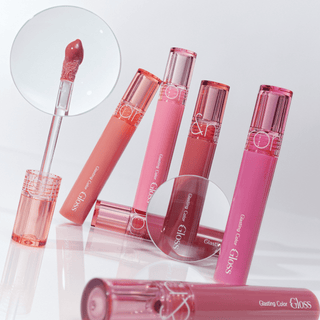 rom&nd Romand Glasting Colour Gloss lip gloss tube with a shiny, transparent finish and colorful packaging.