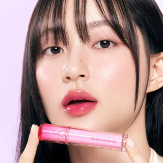 Rom&nd The Juicy Lasting Lip Tint in 3.5g, featuring a vibrant pink shade with a glossy finish and sleek packaging.