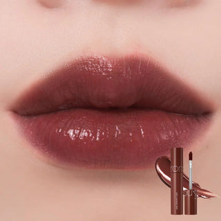 rom&nd The Juicy Lasting Tint in Dark Coconut, a vibrant lip tint with a smooth, glossy finish, applied on lips.
