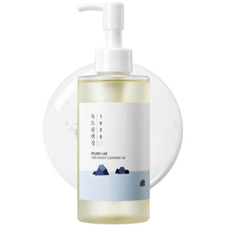 ROUND LAB 1025 Dokdo Cleansing Oil in a clear bottle, featuring a pump dispenser, designed for gentle facial cleansing.