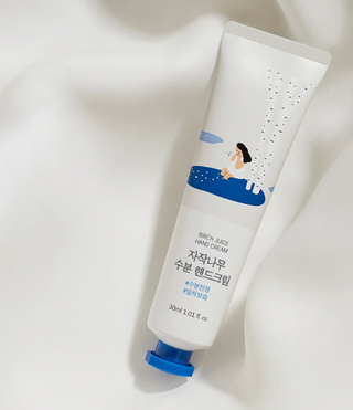 ROUND LAB Birch Juice Hand Cream in 30ml tube, featuring natural ingredients and a smooth, hydrating texture for soft hands.