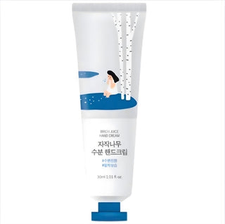 Cream container labeled ROUND LAB Birch Juice Hand Cream 30ml with a clean, minimalist design and natural branding.