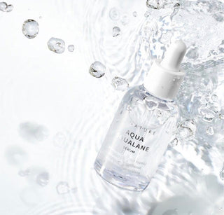 S.NATURE Aqua Squalane Serum in a 50ml bottle, clear liquid serum with a dropper cap, on a plain background.