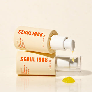 KSECRET Seoul 1988 Glow Serum with 15% Niacinamide and Yuja, featuring a sleek glass bottle and dropper applicator.