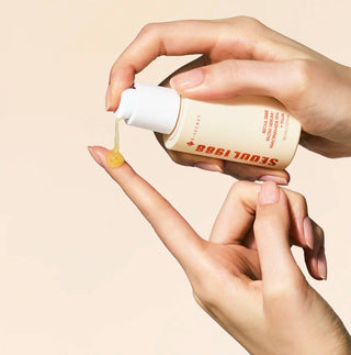 KSECRET Seoul 1988 Glow Serum with Niacinamide 15% and Yuja, featuring a sleek bottle and serum dropper for brightening skincare.