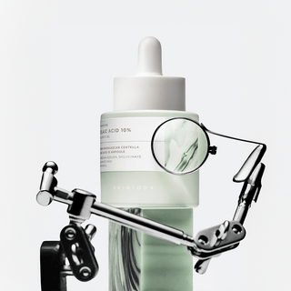 SKIN1004 Madagascar Centella Azelaic Acid 10% Ampoule 30ml, clear glass bottle with dropper for skincare treatment.