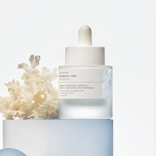 Skin1004 Madagascar Centella Matrixyl 10% Boosting Shot Ampoule 30ml bottle, clear glass with dropper cap, on a white background.