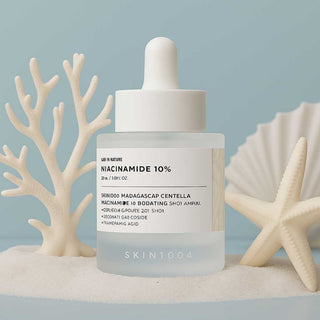 Skin1004 Madagascar Centella and Niacinamide 10% Boosting Shot Ampoule in a clear 30ml bottle, with a dropper applicator.
