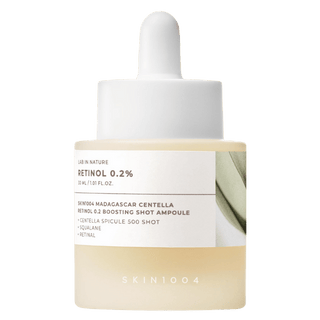 Skin1004 Madagascar Centella Retinol 0.2% ampoule in a 30ML bottle, showcasing the skincare product with clear branding.